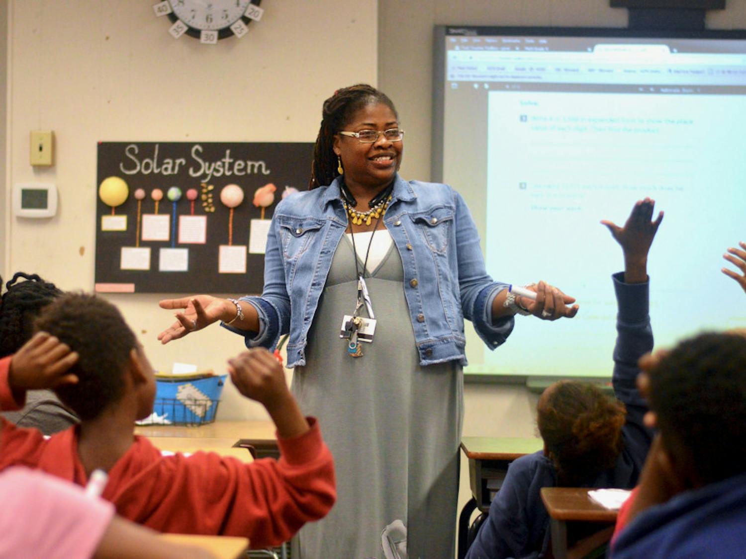 [FILE PHOTO] 35-year-old Lilliemarie Gore leads students of Idylwild Elementary School through a series of math exercises. Mrs. Gore was awarded the title of "2017-2018 Alachua County Teacher of the Year" earlier this month. 