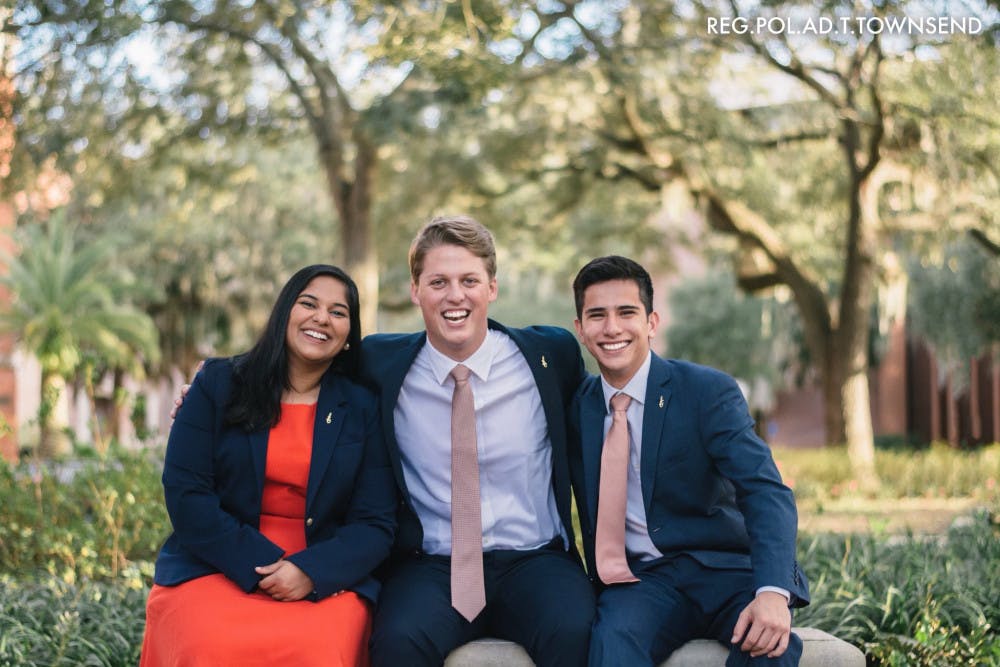 Impact Party's executive ticket consists of Michael Murphy, 21, for Student Body president (center); Sarah Abraham, 20, for Student Body vice president (left); and Santiago Gutierrez, 20, for Student Body treasurer (right).