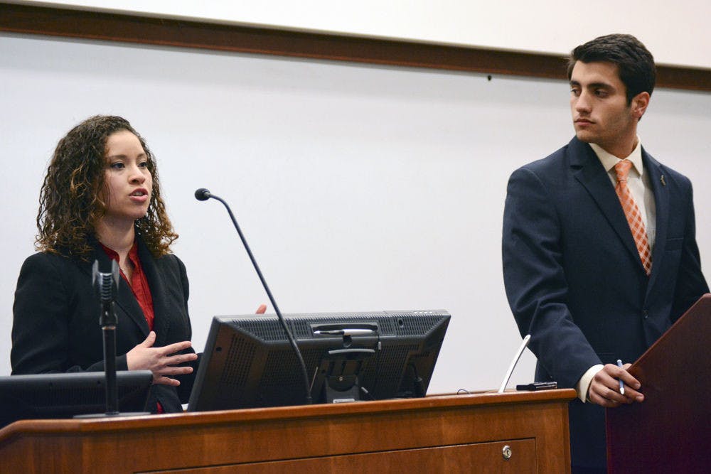 Senator Yareliz Mendez-Zamora (left), representing District C, announces her disaffiliation from Swamp Party to an independent. “There are things that can no longer be ignored in these senate chambers,” Mendez-Zamora said, “and I believe that by changing my affiliation to the independent coalition I can truly represent 100 percent of the student body.” Senate President and Swamp candidate for Student Body President, Joseph&nbsp;Michaels, looks on.&nbsp;