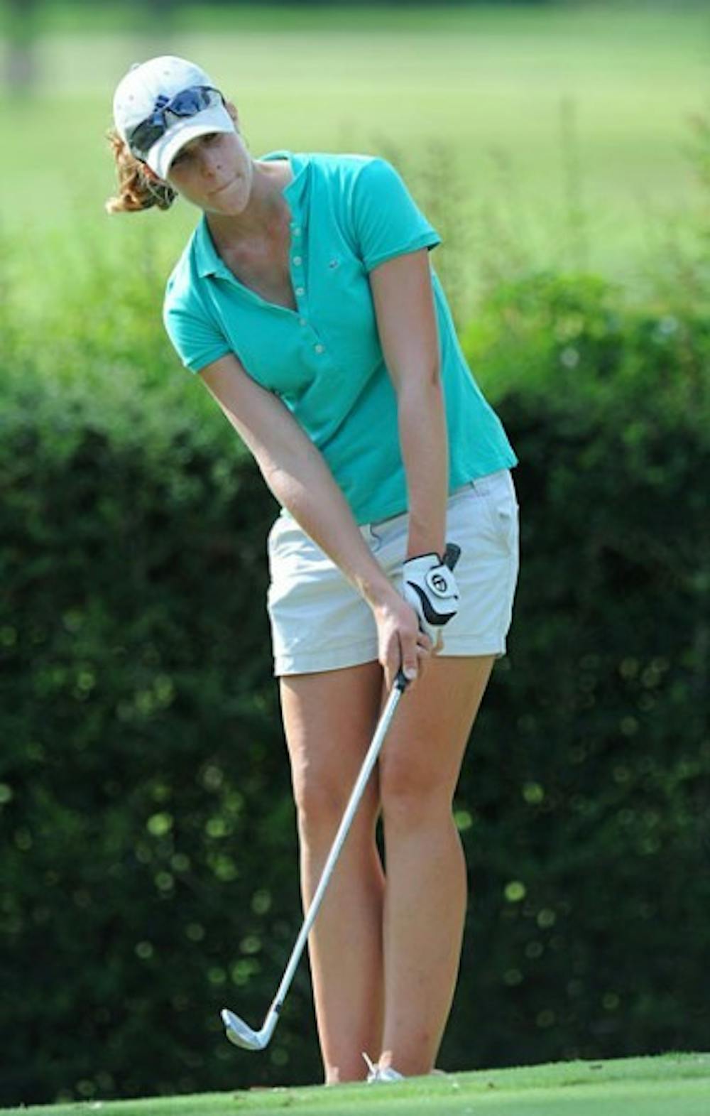 <p>Senior Isabelle Lendl chips a shot onto the green. Lendl finished tied for 32nd at the Bryan National Collegiate this weekend.</p>