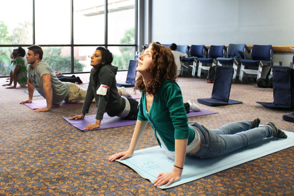 <p>Camille Mekwinski, a 20-year-old UF environmental engineering sophomore, attends a holistic breathing course at the Reitz Union on Thursday evening.</p>