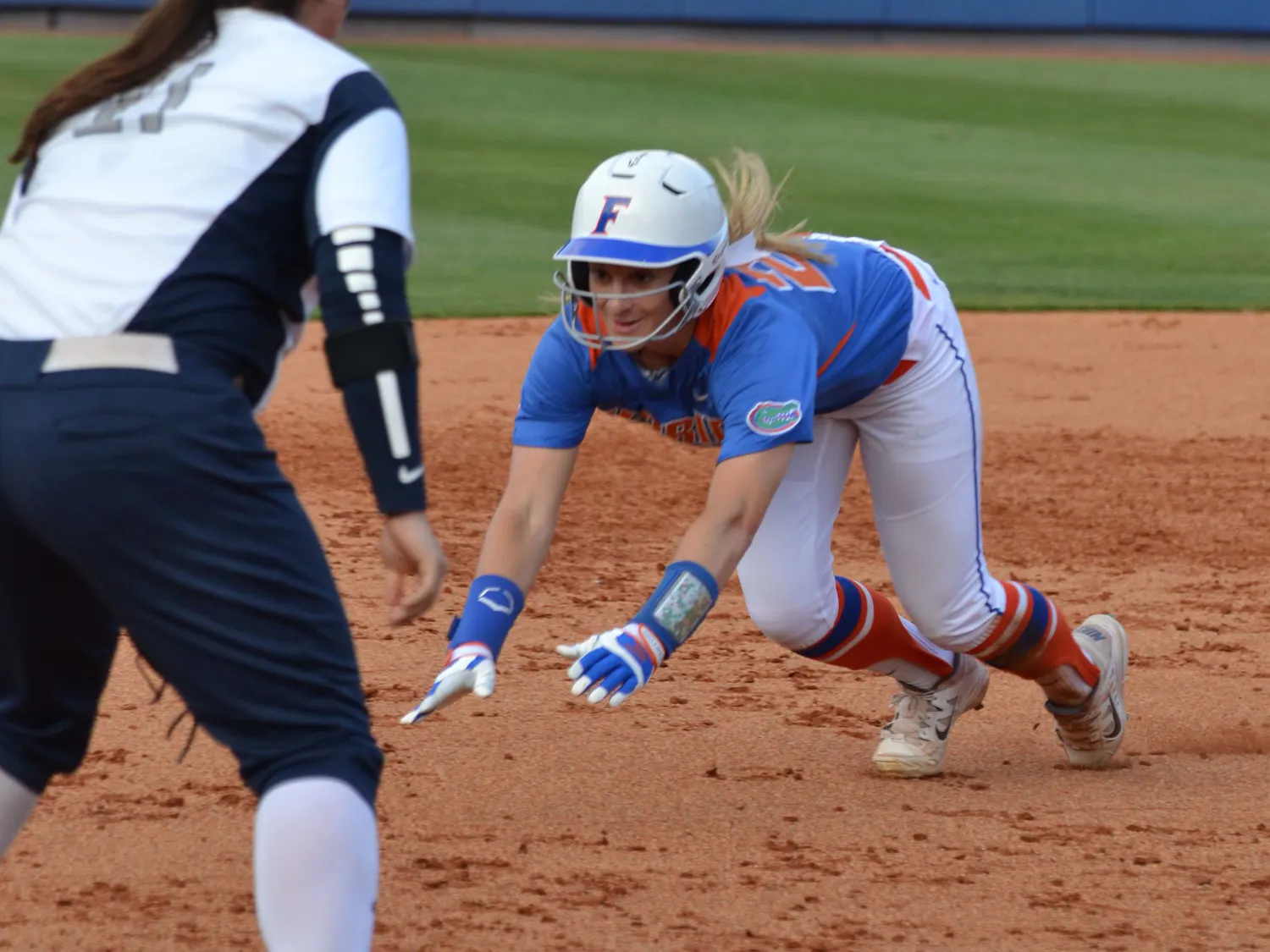 Kirsti Merritt smiles as she slides into third base during Florida's 2-1 win against North Florida on April 1, 2015, at Katie Seashole Pressly Stadium.