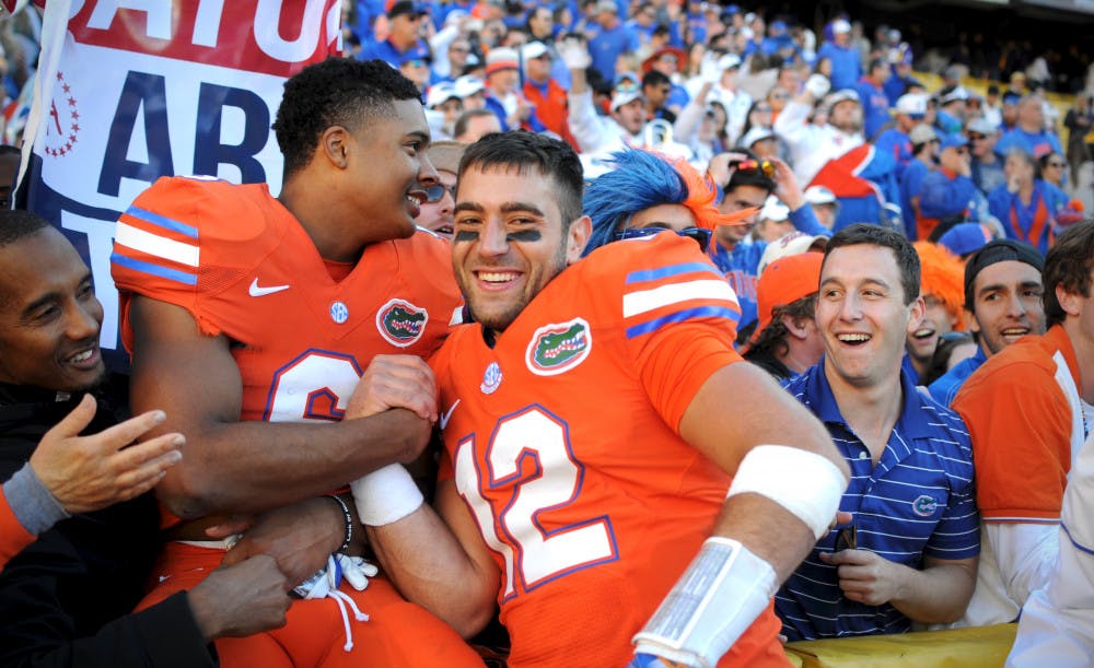 <p>Austin Appleby, right, celebrates with Quincy Wilson after Florida's 16-10 win against LSU on Nov. 19, 2016, at Tiger Stadium in Baton Rouge, Louisiana. </p>