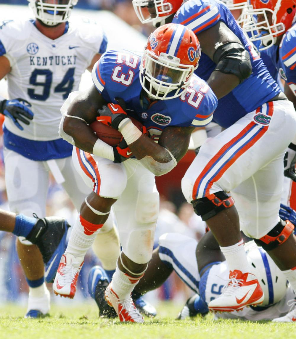 <p>Senior running back Mike Gillislee runs down the field against Kentucky on Sept. 22 at Ben Hill Griffin Stadium. Florida gained 200 yards rushing while allowing 159 yards.</p>