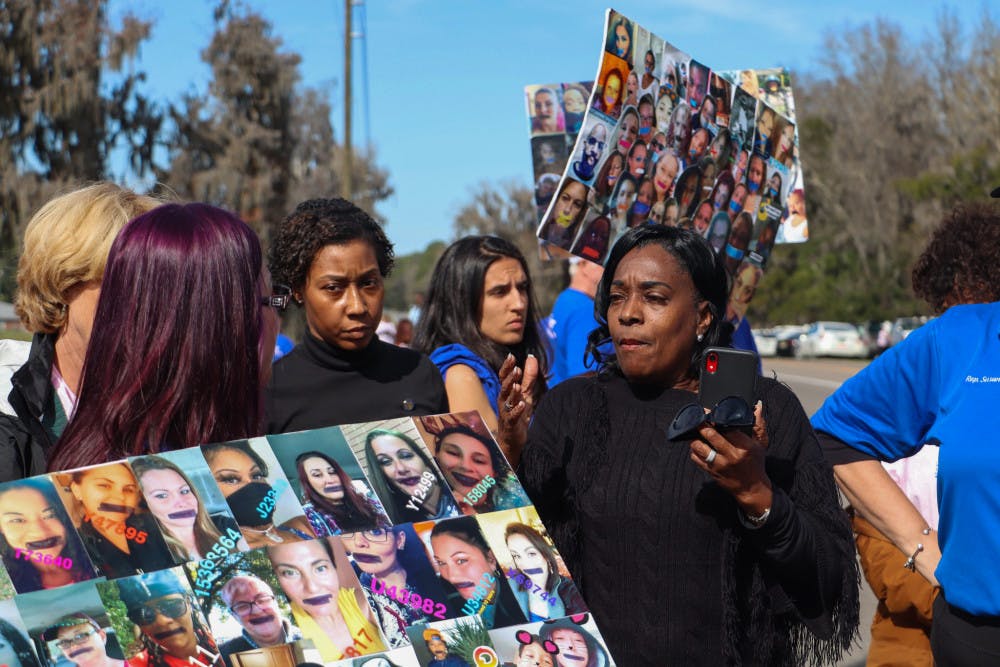 Rep. Dianne Hart talks to protesters on Sunday. The protesters are a part of the National Council for Incarcerated and Formerly Incarcerated Women and Girls.