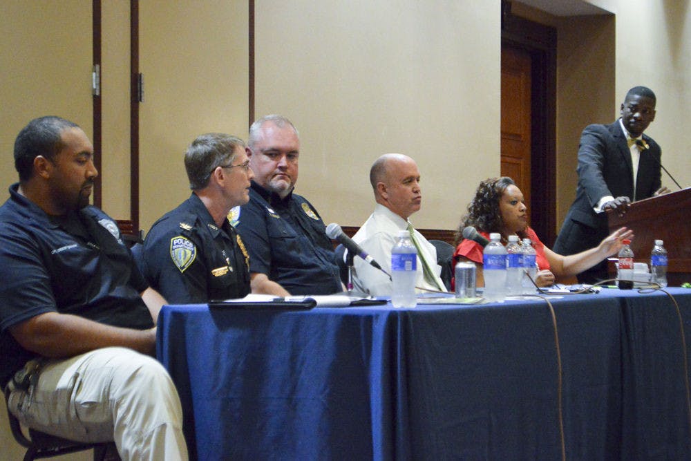 (From left) Santa Fe College Chief Ed Book, University Police Deputy Chief Darren Baxley, Gainesville Police Chief Tony Jones and UF leaders hold a forum Thursday night to discuss police brutality around the country in the Reitz Union Grand Ballroom.