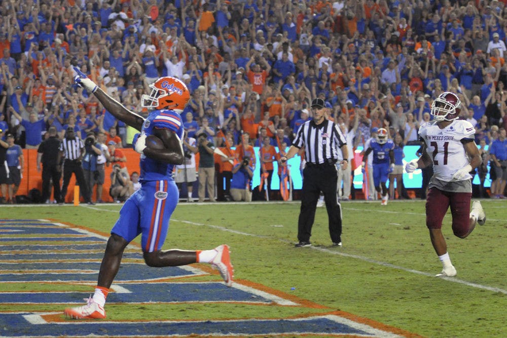 UF tight end C'yontai Lewis celebrates as he scores a touchdown during Florida's 61-13 win against New Mexico State on Saturday at Ben Hill Griffin Stadium.
