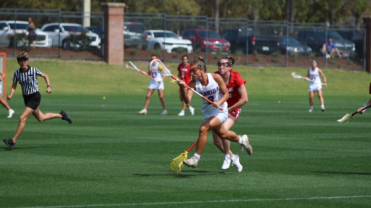 Florida midfielder Emily Heller carries the ball in her crosse in the Gators' 14-13 loss to the Maryland Terrapins Saturday, Feb. 25, 2023.