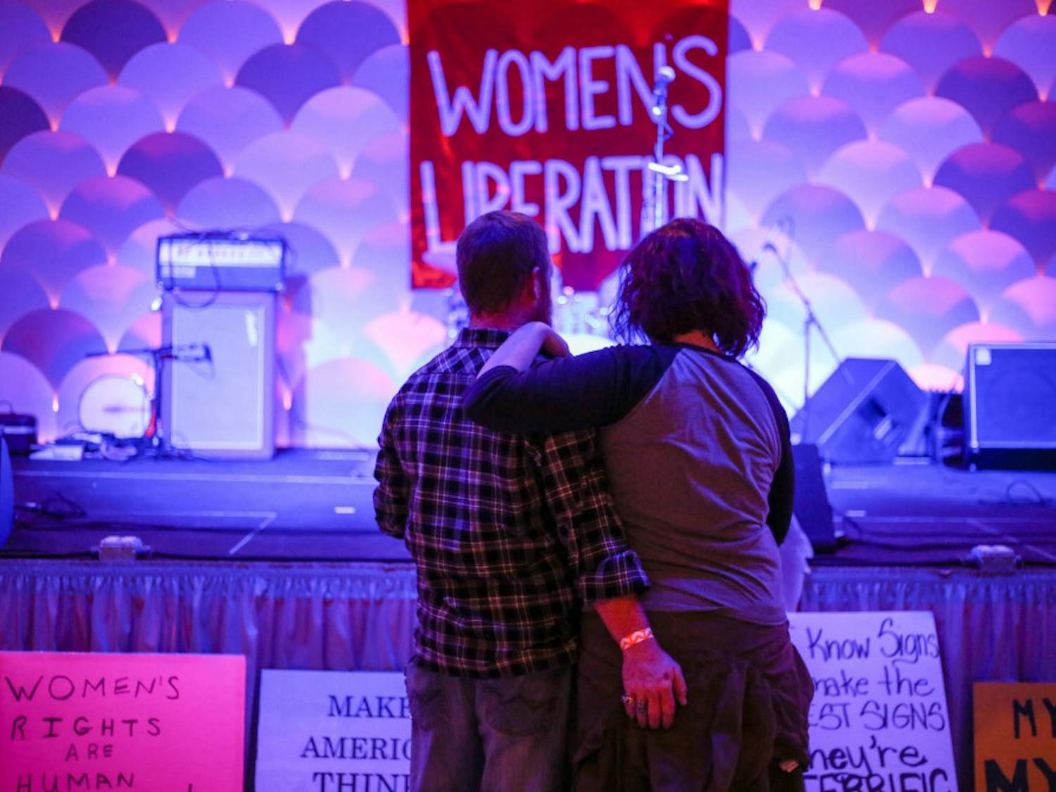 From left: 37-year-old Get Barber accompanies his girlfriend, 29-year-old Laurel Huntoon, to the Fourth Annual Roe v. Wade Anniversary Show, where the bands The Howleez, Bite Marks, The Ones to Blame, Endless Pools and Guts! performed. "I love the bands," Huntoon said.