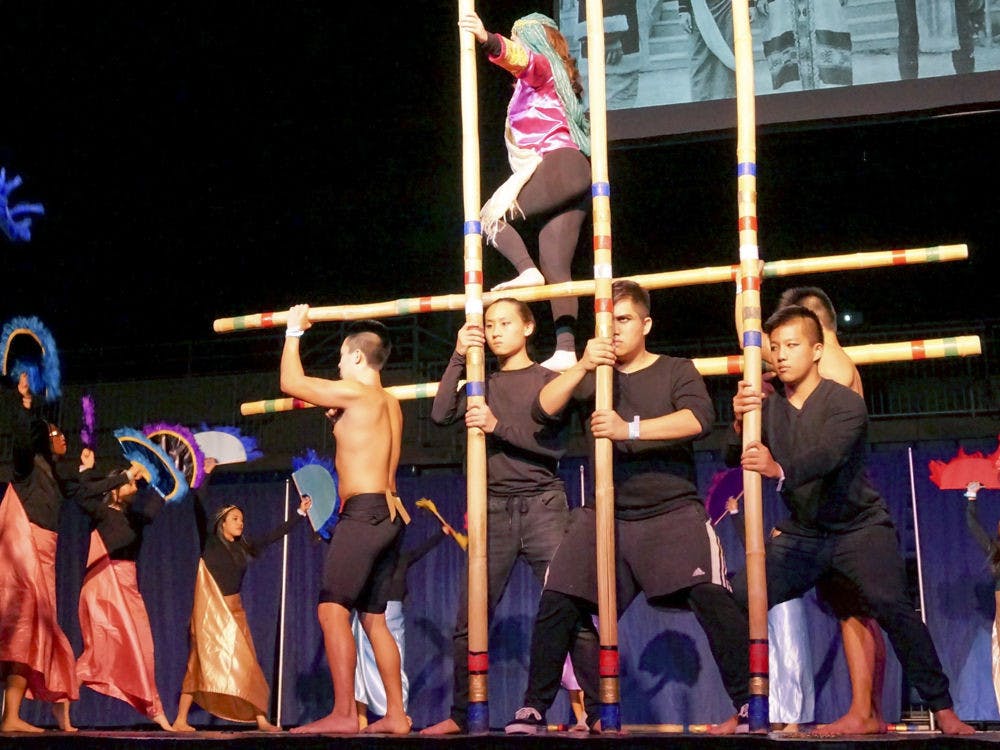<p>The Filipino Student Association perform during the Volunteers for International Student Affairs talent show on Thursday night at the Stephen C. O’Connell Center. The FSA took home first place in the talent competition.</p>