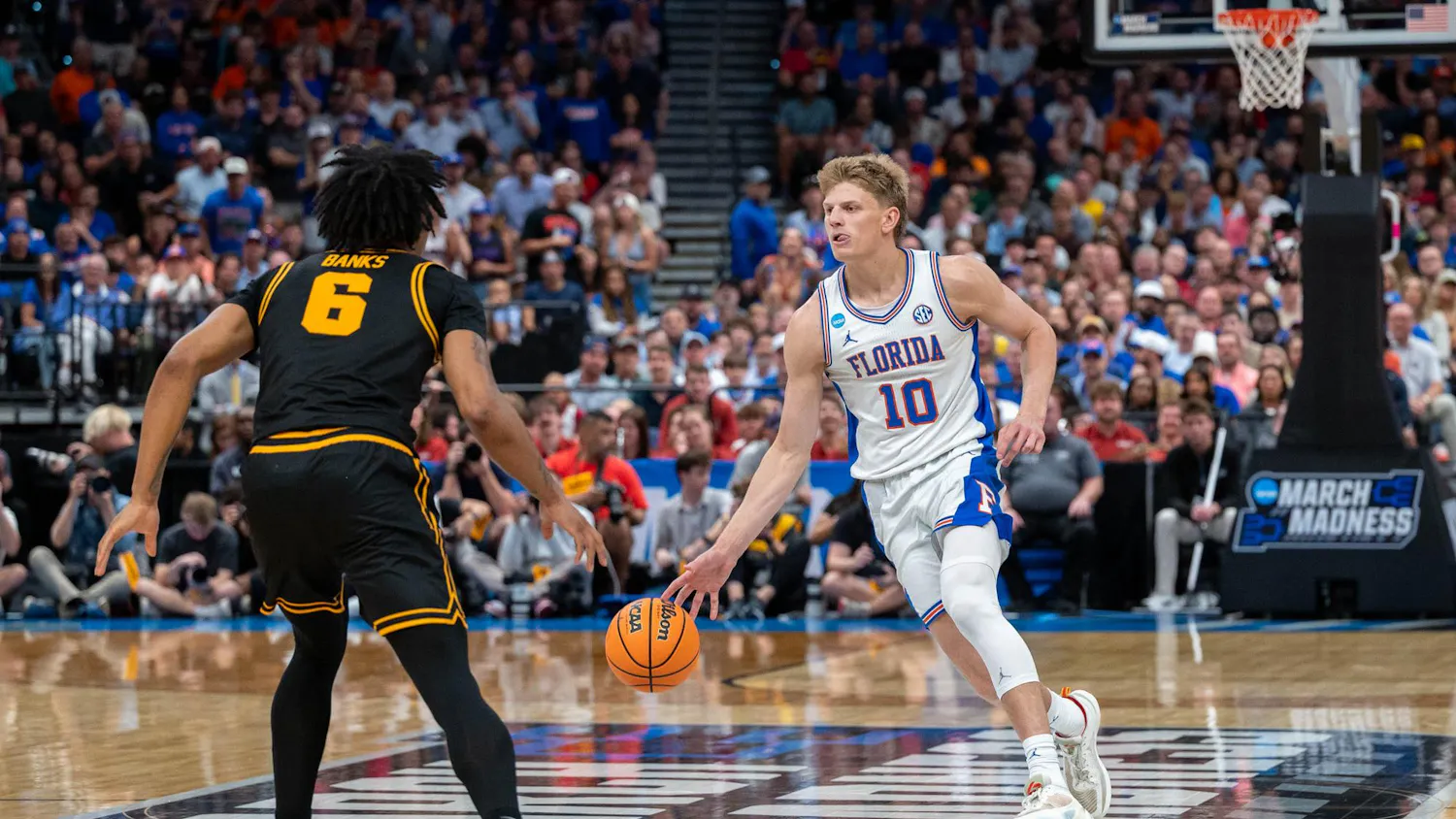 Florida forward Thomas Haugh (10) dribbles down the court during the second half of an NCAA Tournament second round game against Iowa, Sunday, March 22, 2026, in Tampa, Fla.
