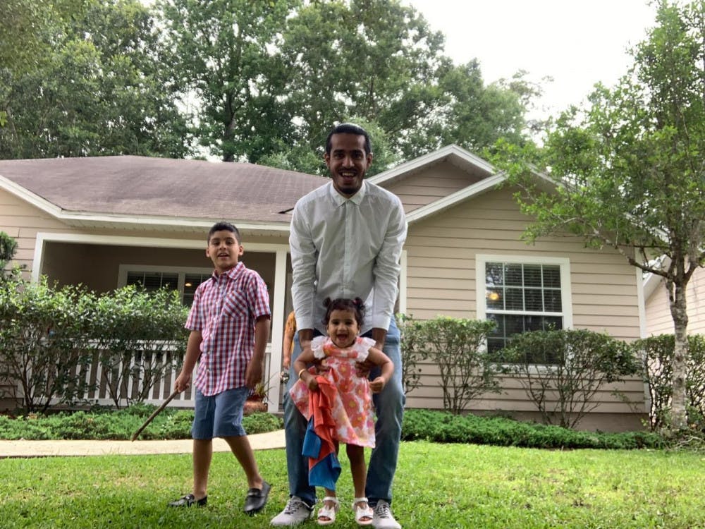 Nawaf Alrogiaee celebrates Eid al-Fitr from his family’s Gainesville home alongside his two children, Ammar, 7, and Alia, 1. 