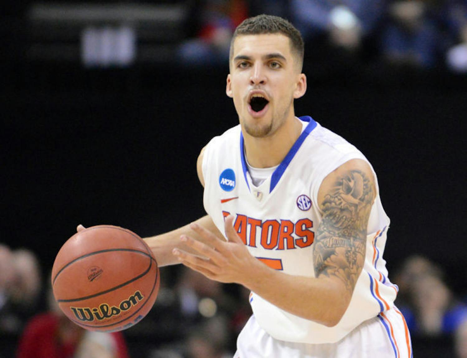 Scottie Wilbekin calls out a play during Florida’s 62-52 win against Dayton on Saturday in FedExForum in Memphis, Tenn. Wilbekin was in the locker room with a high ankle sprain when Connecticut guard Shabazz Napier hit his buzzer-beater shot to top Florida 65-64 on Dec. 2.