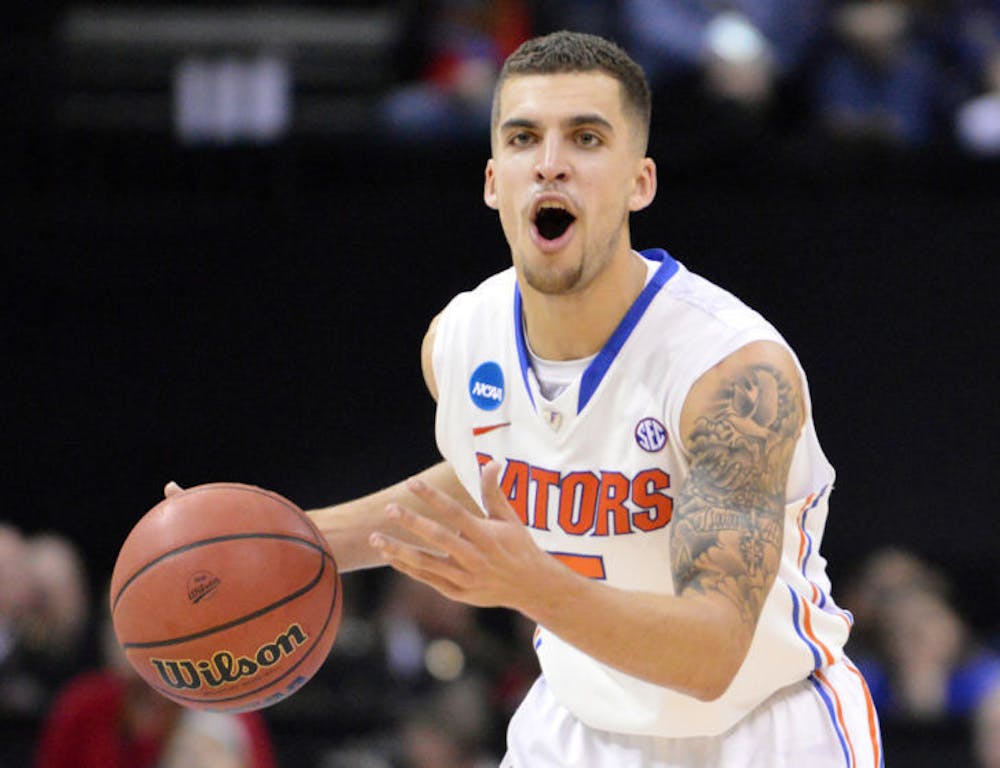 <p>Scottie Wilbekin calls out a play during Florida’s 62-52 win against Dayton on Saturday in FedExForum in Memphis, Tenn. Wilbekin was in the locker room with a high ankle sprain when Connecticut guard Shabazz Napier hit his buzzer-beater shot to top Florida 65-64 on Dec. 2.</p>