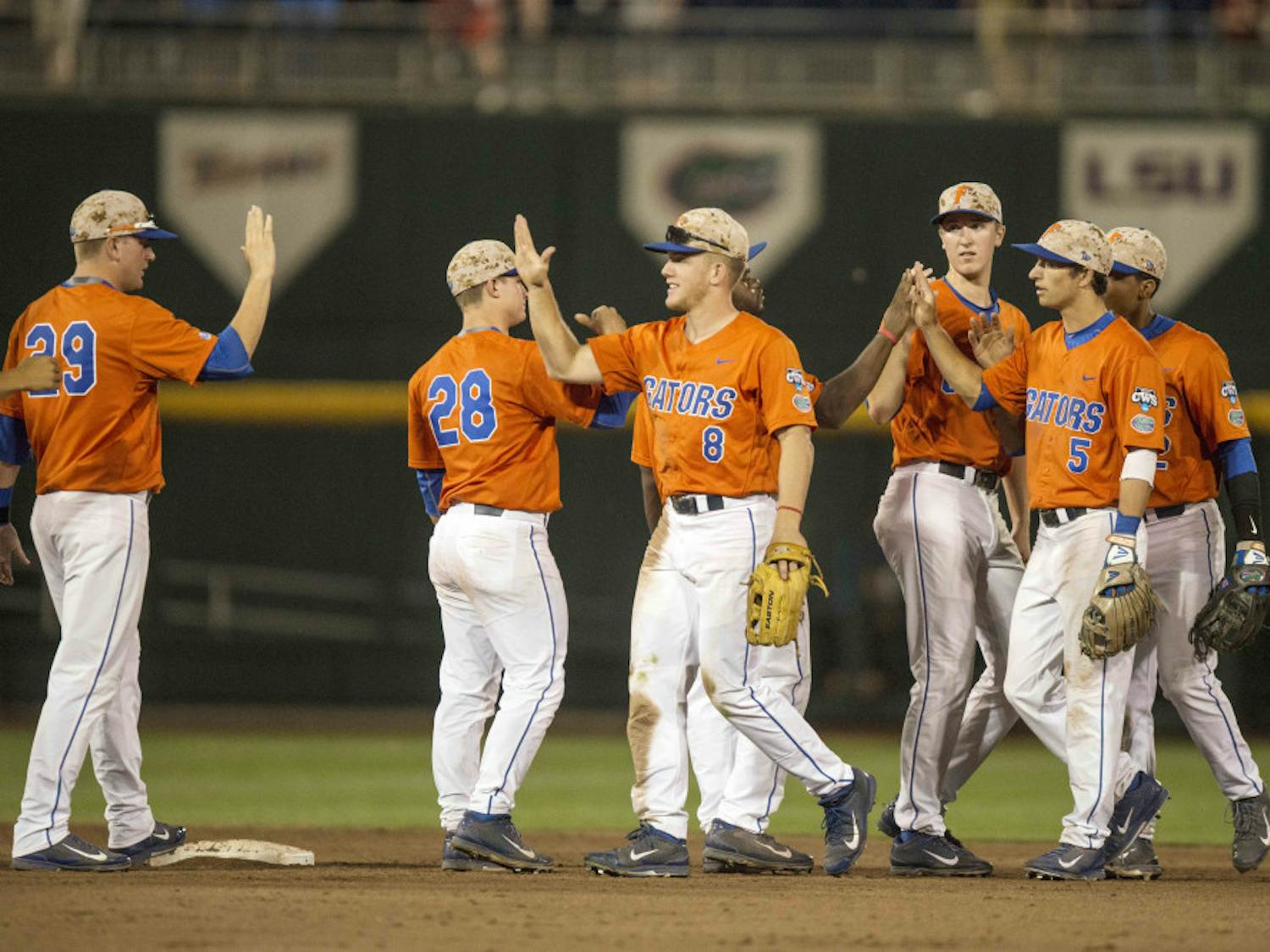 Florida players celebrate following the Gators' 10-2 victory against Miami in the NCAA Men's College World Series on Wednesday, June 17, 2015 at TD Ameritrade Park in Omaha, Nebraska