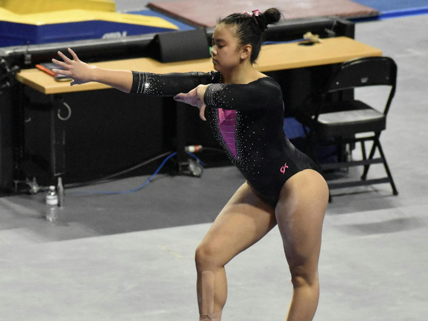Freshman Ellie Lazzari performs a routine on the balance bar on Feb. 19 against Kentucky. She was nearly perfect on Friday against Auburn as she posted a 9.975.