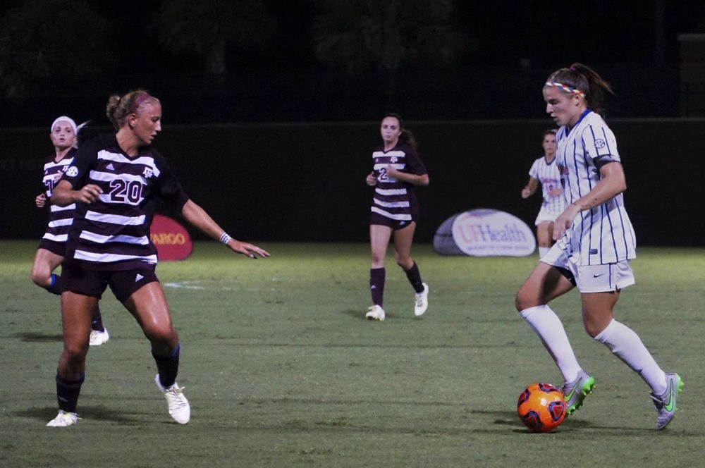 UF forward Savannah Jordan (right) dribbles the ball during the Gators' 2-1 loss to Texas A&amp;M on Sept. 10, 2015, at Donald R. Dizney Stadium.