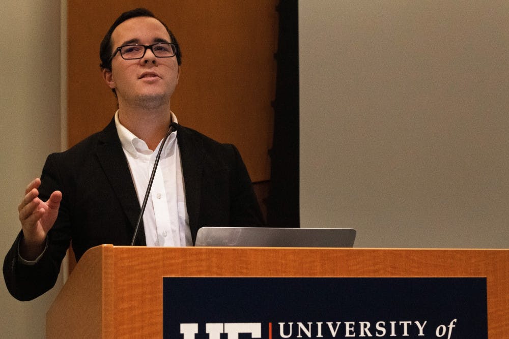 Ben Lima, a representative from Inspire Party, speaks during a student government meeting in the Reitz Union Chamber Room Tuesday evening. Lima drafted a resolution calling to impeach Student Body President Michael Murphy.
