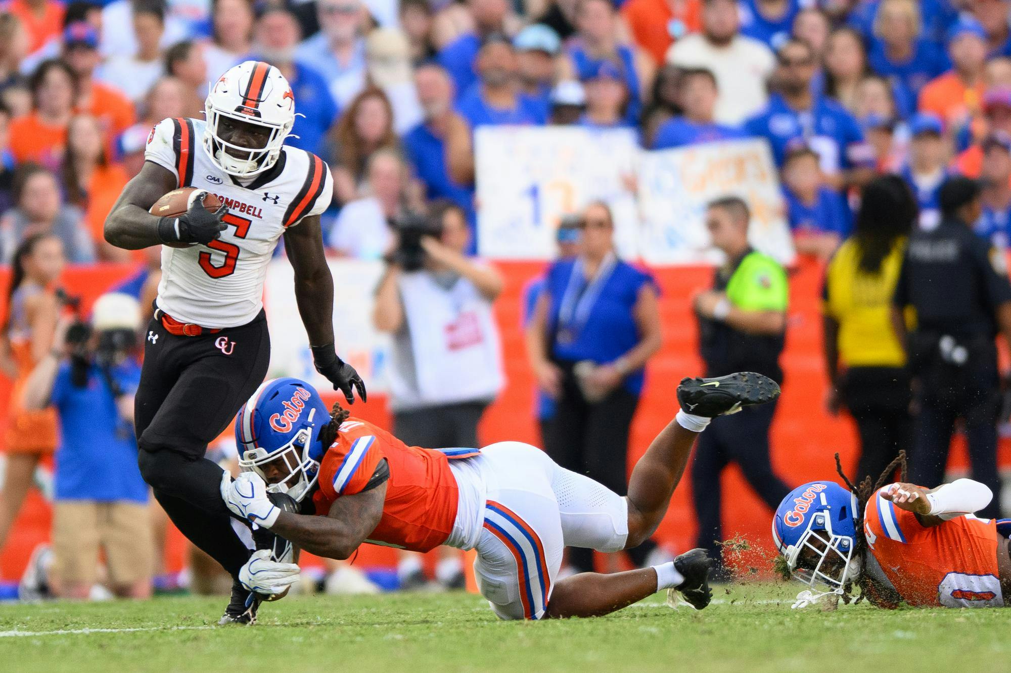 Campbell running back JJ Cowan (5) rushes during the first half of an NCAA college football game against Campbell, Saturday, Sept. 12, 2026, in Gainesville, Fla.