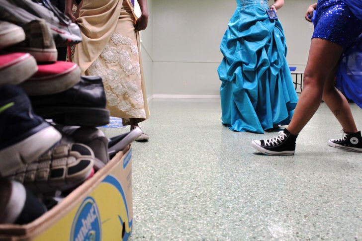 The members of the UF Lambda Rho chapter of Sigma Gamma Rho sorority wear sneakers to a formal dance on Saturday in the Broward Hall basement. The group collected $1,000 and about 100 pairs of sneakers for Soles4Souls and St. Francis House.