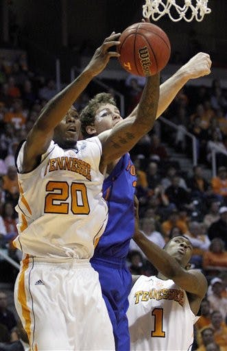 Tennessee's Kenny Hall (20) grabs a rebound away from Florida's Erik Murphy in the first half of an NCAA college basketball game on Saturday, Jan. 7, 2012, in Knoxville, Tenn. Tennessee won 67-56. (AP Photo/Wade Payne)