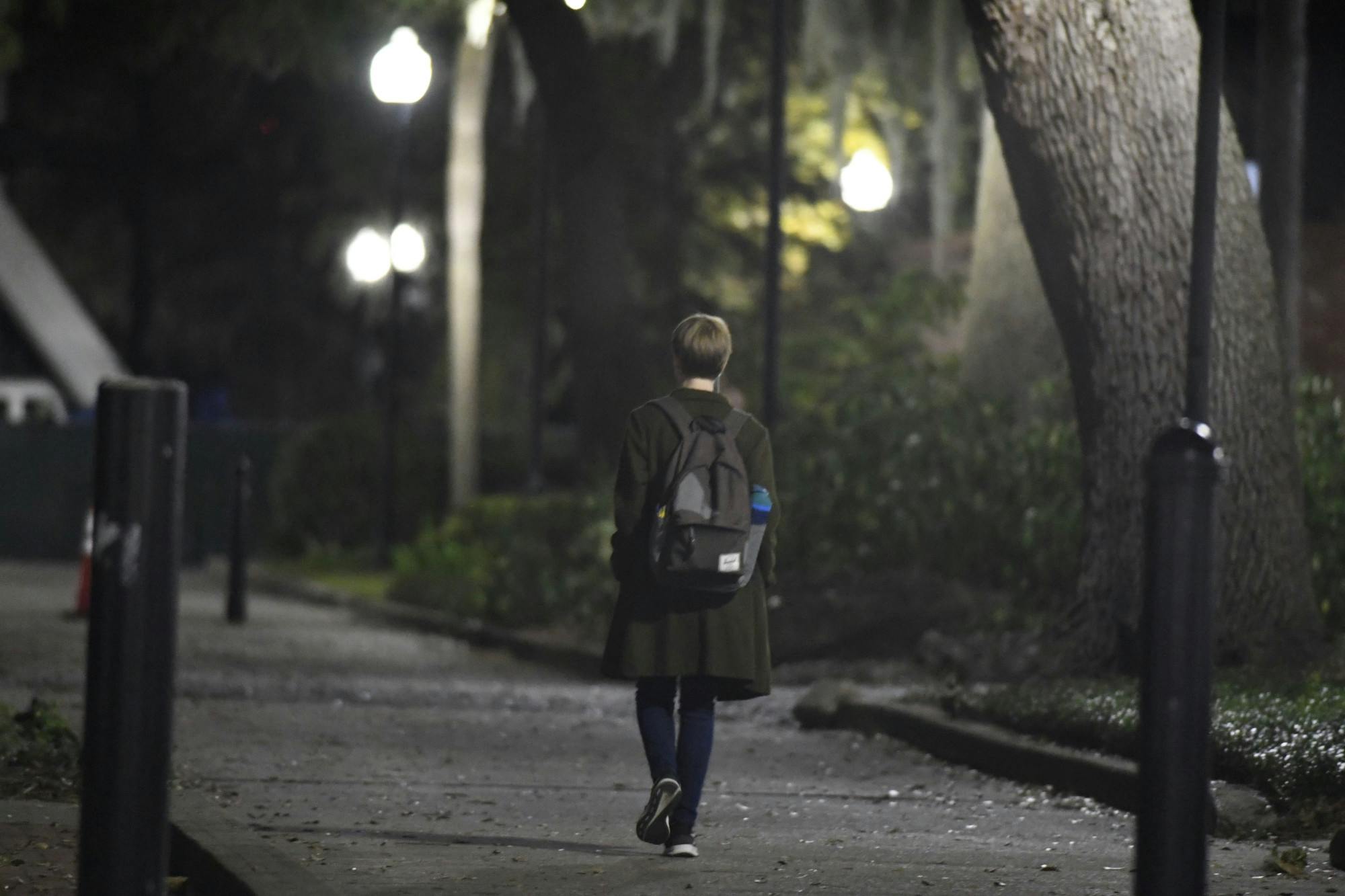 UF student bundles up to walk across campus on Dec. 1, 2024.