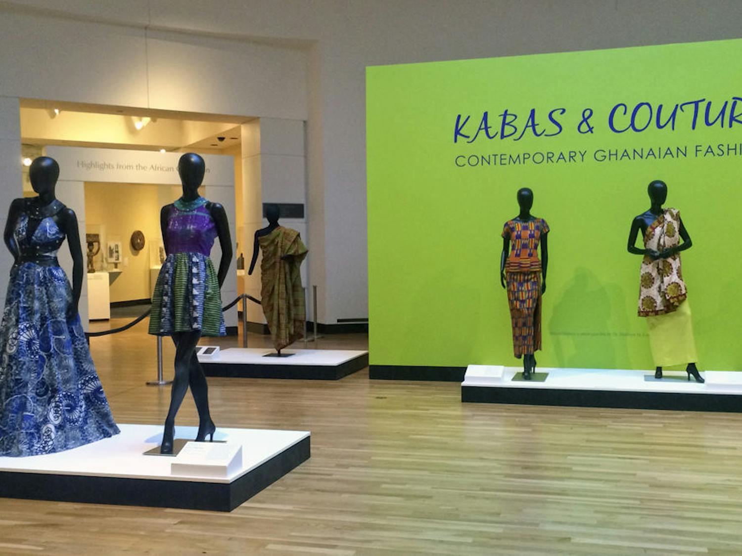 Mannequins wearing examples of Ghanaian fashion stand in one of the exhibit rooms in the Harn Museum of Art.