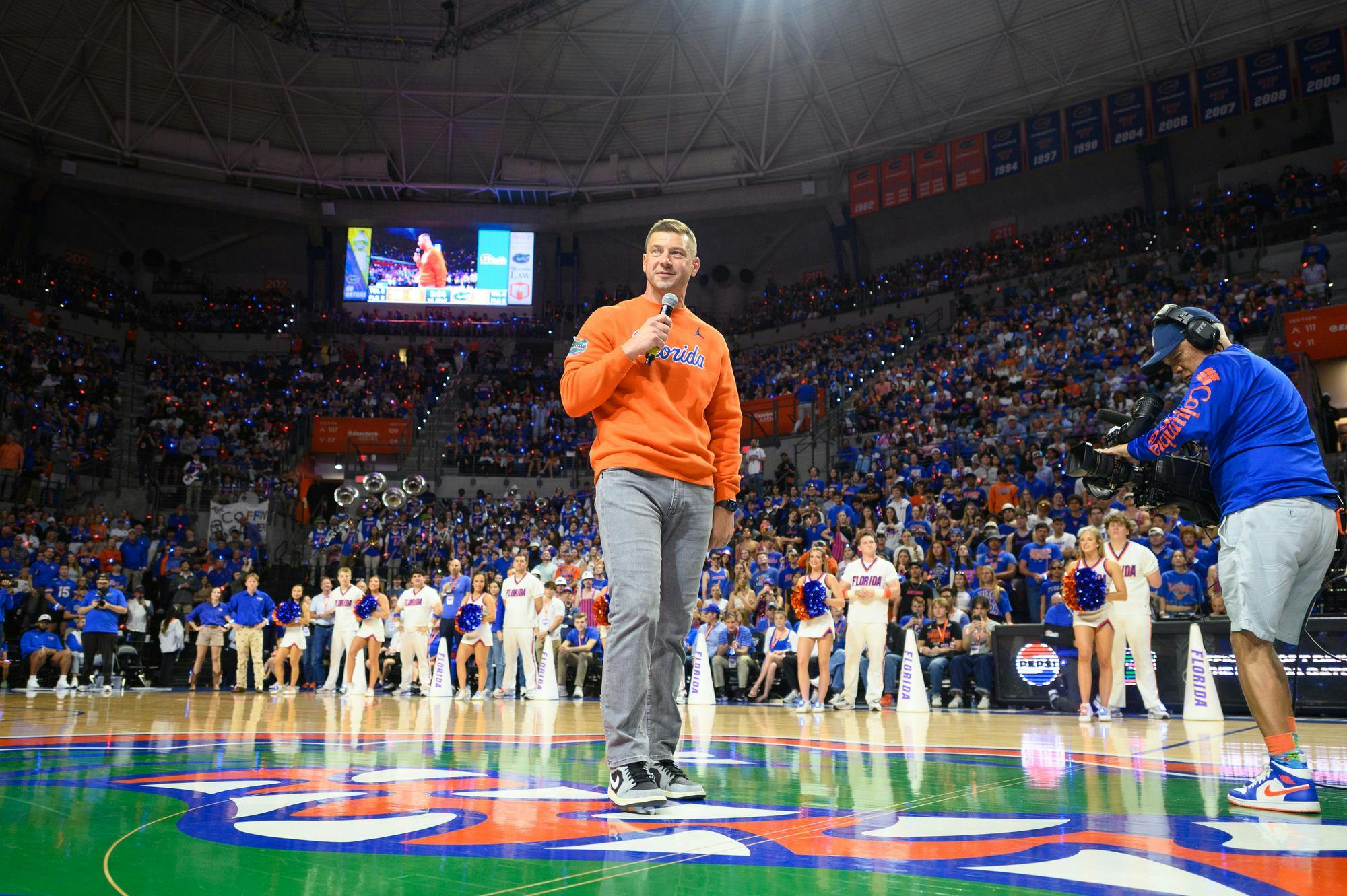 Florida head football coach Jon Sumrall speaks to a crowd of over 11,000 fans during a timeout in an NCAA men’s basketball game between Florida and Auburn in Gainesville, Fla., Saturday, Jan. 24, 2026.