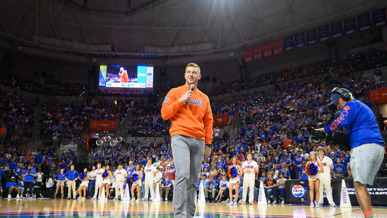 Florida head football coach Jon Sumrall speaks to a crowd of over 11,000 fans during a timeout in an NCAA men’s basketball game between Florida and Auburn in Gainesville, Fla., Saturday, Jan. 24, 2026.