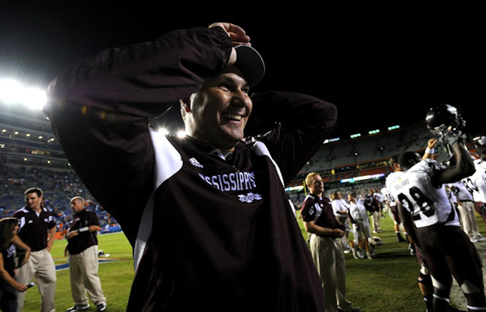 <p>Mississippi State head coach Dan Mullen, who spent four years as UF’s offensive coordinator under Urban Meyer, celebrates on the field after his Bulldogs defeated the Gators 10-7 in 2011.</p>