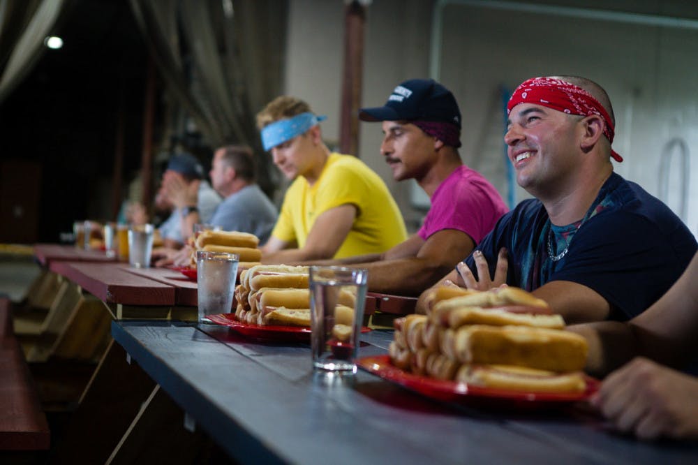 Members of Marion County Fire Rescue wait to begin the first annual “Sausages for Safety” hot dog eating competition on Saturday afternoon. The competition, held at First Magnitude Brewing Company, was a fundraiser for Safety City.