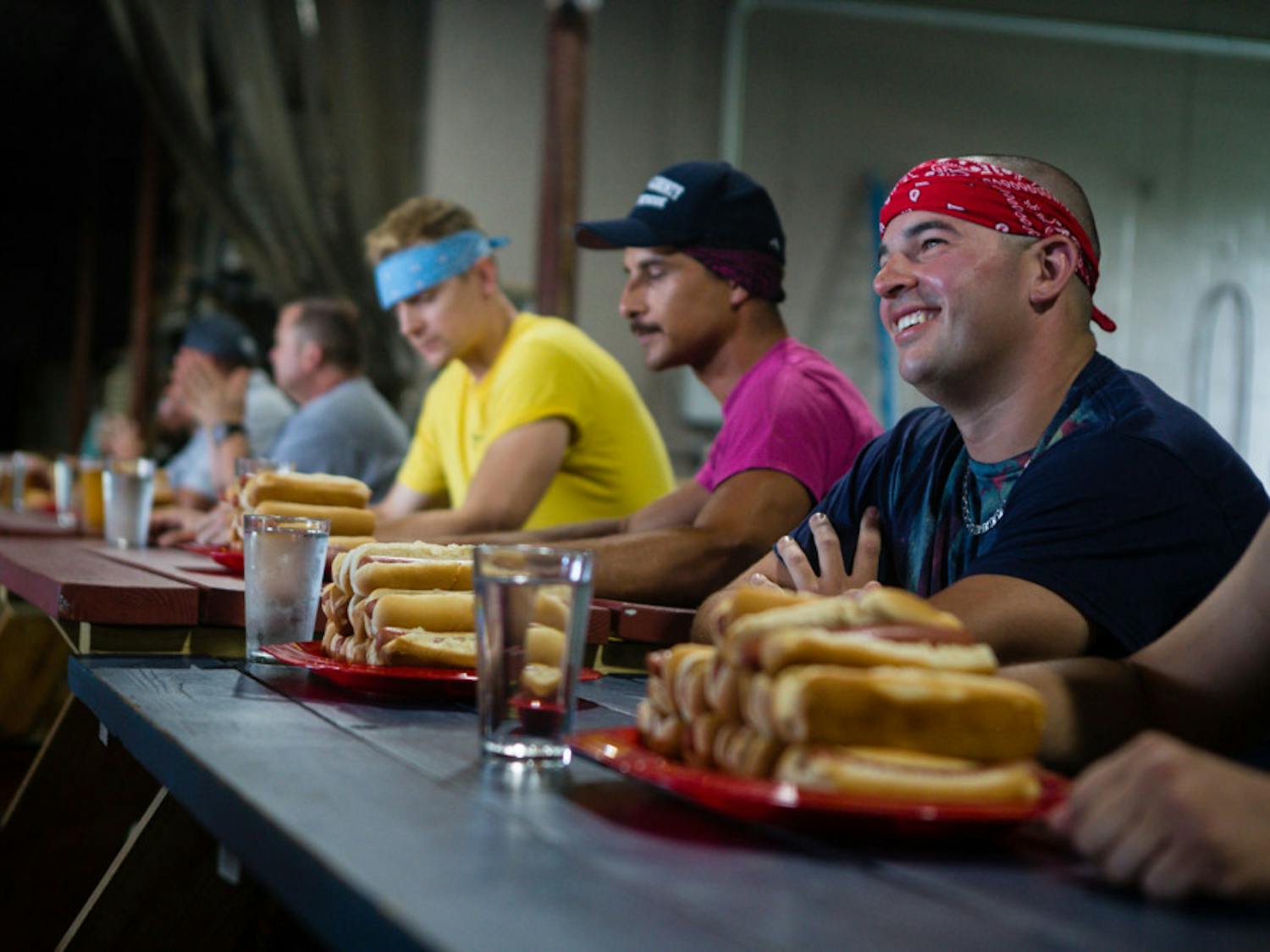 Members of Marion County Fire Rescue wait to begin the first annual “Sausages for Safety” hot dog eating competition on Saturday afternoon. The competition, held at First Magnitude Brewing Company, was a fundraiser for Safety City.