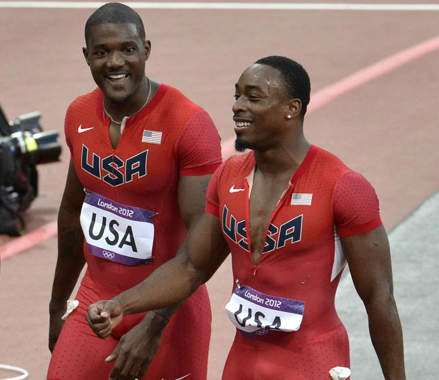 Jeff Demps (right) smiles during the 2012 Summer Olympics in London, England.