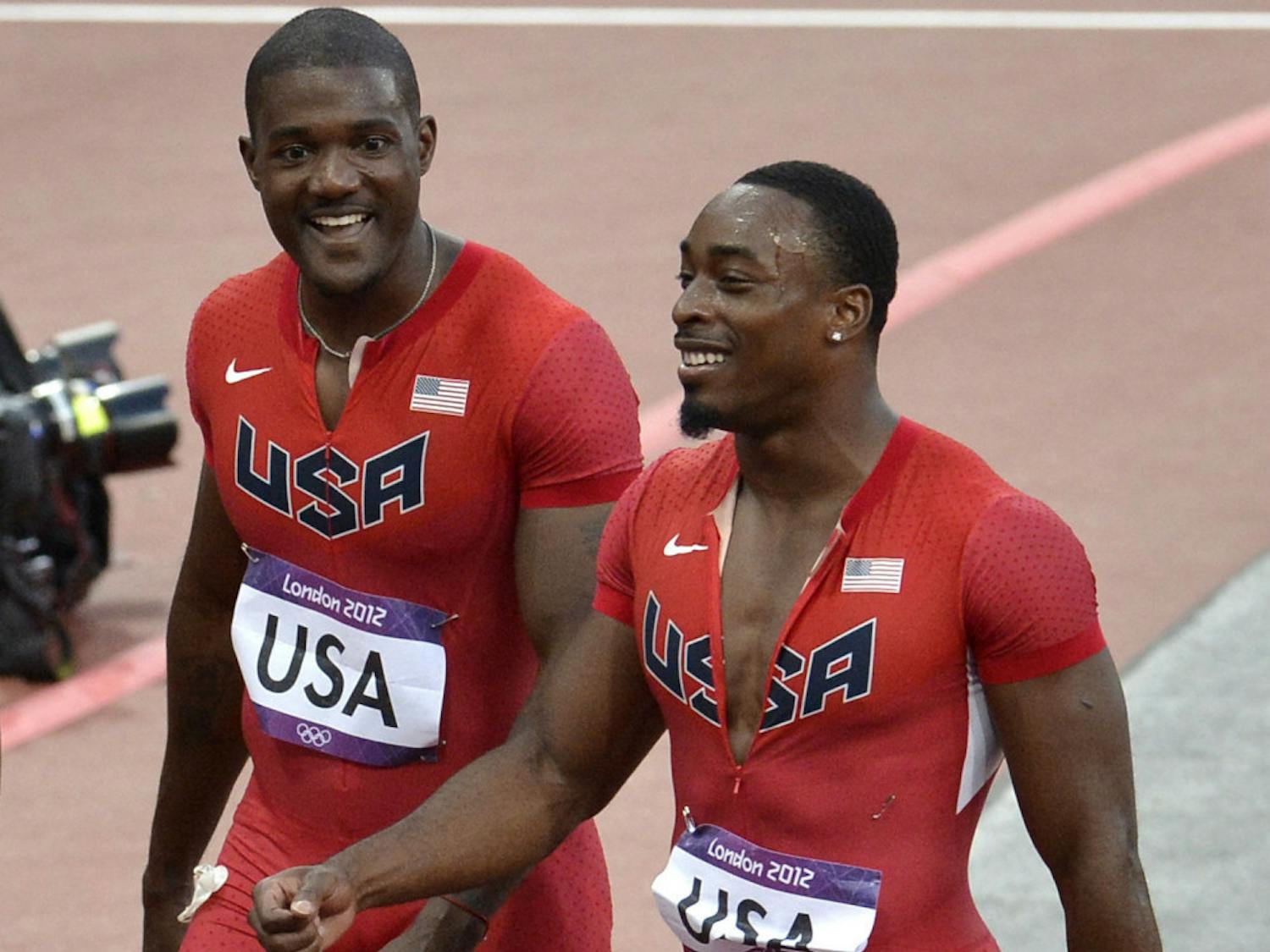 Jeff Demps (right) smiles during the 2012 Summer Olympics in London, England.