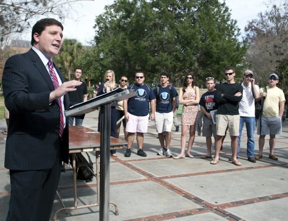 <p>T.J. Villamil, presidential candidate for the Unite Party, speaks outside the Reitz Union on Wednesday afternoon.</p>