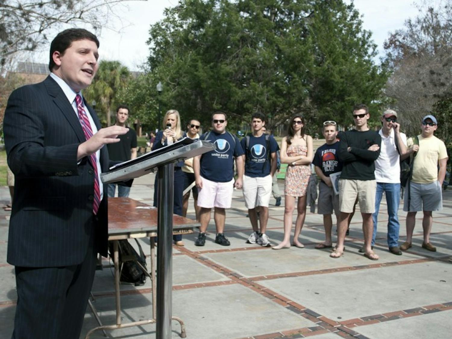T.J. Villamil, presidential candidate for the Unite Party, speaks outside the Reitz Union on Wednesday afternoon.