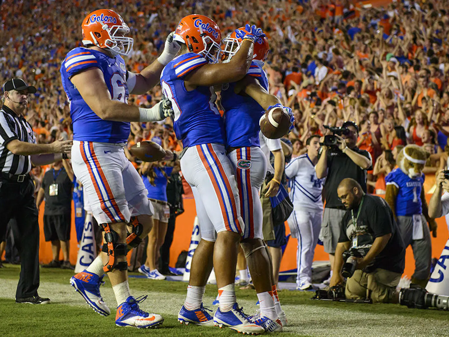 Gators celebrate after Demarcus Robinson (11) OT TD during the match between the Florida Gators and the Kentucky Wildcats Staurday night in Ben Hill Griffin Stadium.