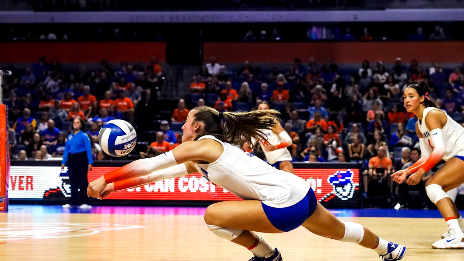 Sophomore libero Emily Canaan dives to set the ball in the Gators' 3-0 win against the LSU Tigers on Friday, Nov. 10, 2023.