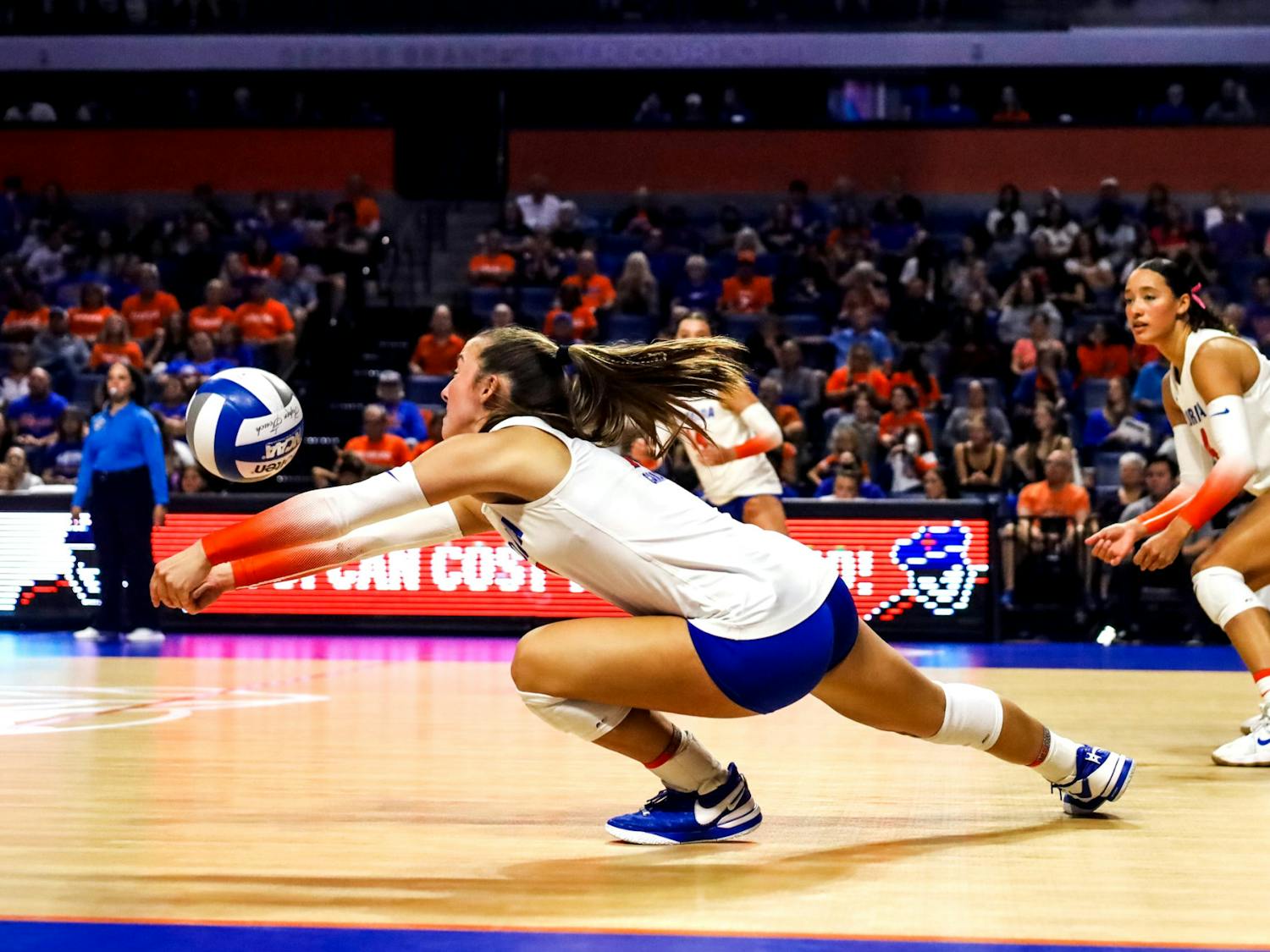 Sophomore libero Emily Canaan dives to set the ball in the Gators' 3-0 win against the LSU Tigers on Friday, Nov. 10, 2023.