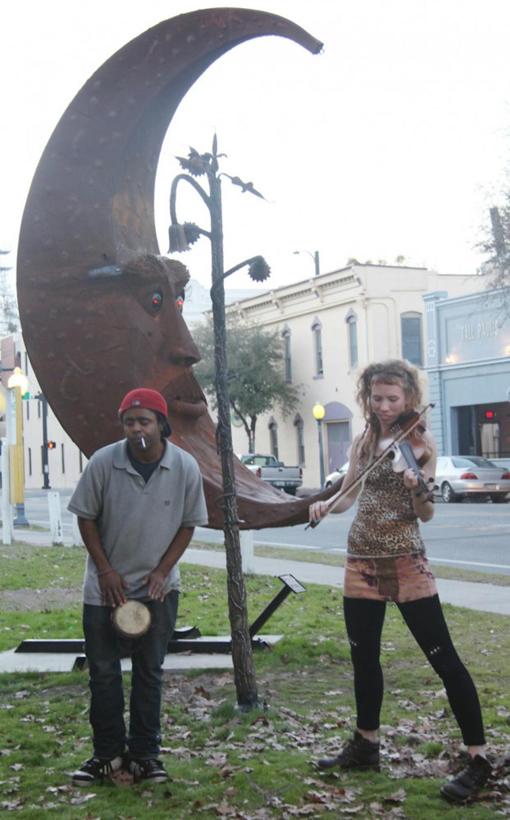 <p class="p1">Ovaryaction plays in front of Luna, the art installation on the corner of Southeast Second Avenue and Southeast First Street, Monday.</p>