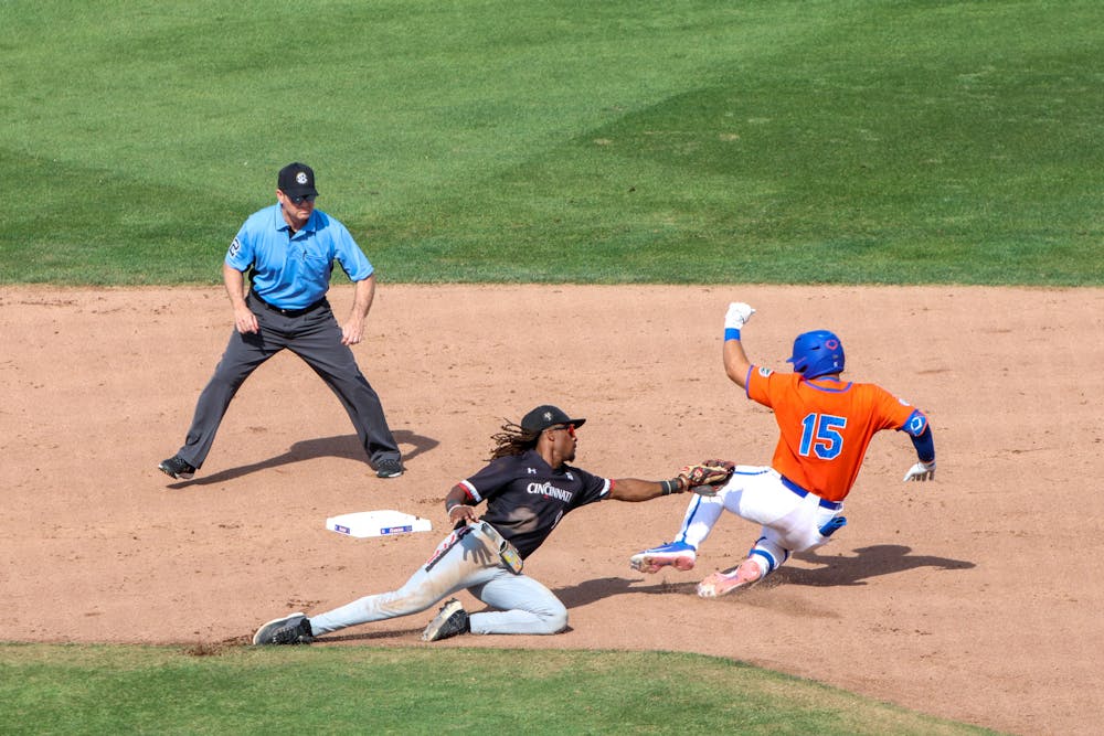 Florida catcher BT Riopelle slides toward second base in the Gators' 13-7 victory against the Cincinnati Bearcats Sunday, Feb. 26, 2023.