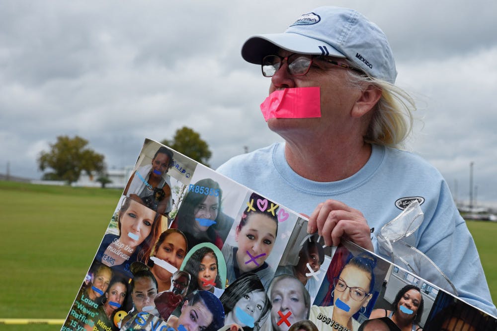 Maureen Houston, a 59-year-old Saint Petersburg resident, protests Saturday outside the Lowell Correctional Institution in Ocala. She has been out of prison for 8 years.