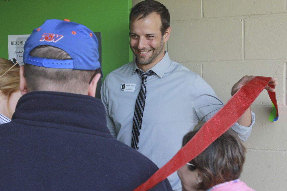 Jon DeCarmine, Grace Marketplace's Director of Operations, welcomes visitors to the homeless shelter’s new kitchen for its inaugural lunch on Nov. 14, 2015. DeCarmine has overseen Grace Marketplace for almost two years and said he looks forward to continuing to serve Gainesville citizens experiencing homelessness.