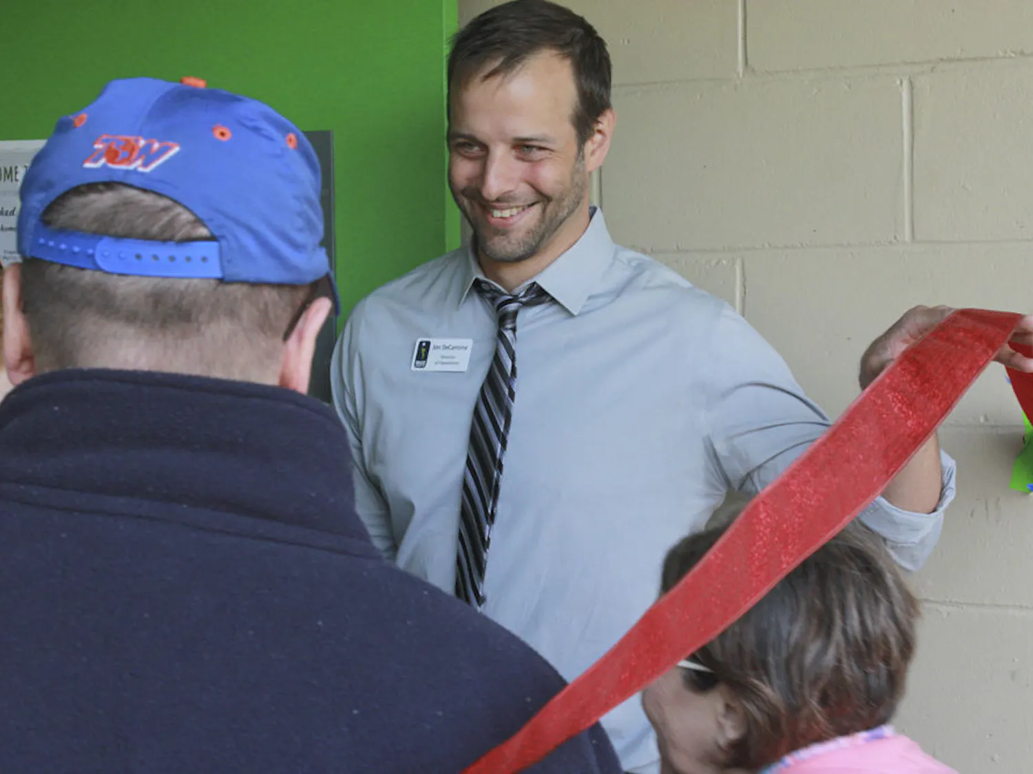Jon DeCarmine, Grace Marketplace's Director of Operations, welcomes visitors to the homeless shelter’s new kitchen for its inaugural lunch on Nov. 14, 2015. DeCarmine has overseen Grace Marketplace for almost two years and said he looks forward to continuing to serve Gainesville citizens experiencing homelessness.