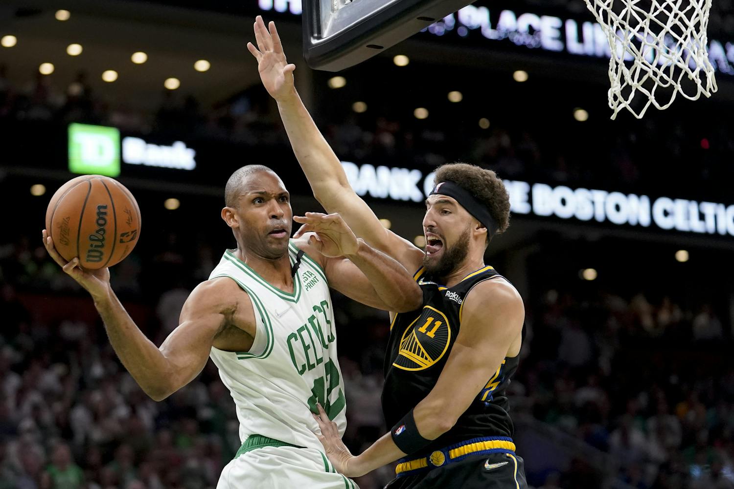 Boston Celtics center Al Horford looks to pass against Golden State Warriors guard Klay Thompson during the second quarter of Game 4 of the NBA Finals, June 10, 2022. (AP Photo/Steven Senne)