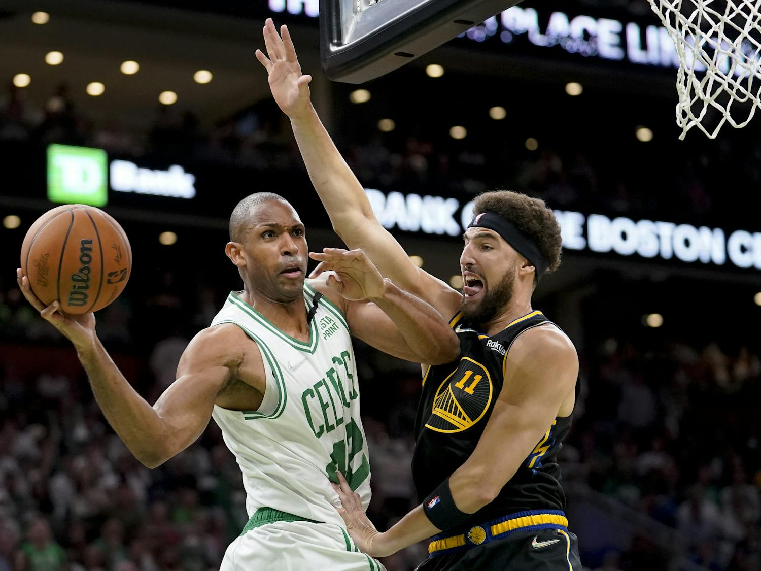 Boston Celtics center Al Horford looks to pass against Golden State Warriors guard Klay Thompson during the second quarter of Game 4 of the NBA Finals, June 10, 2022. (AP Photo/Steven Senne)