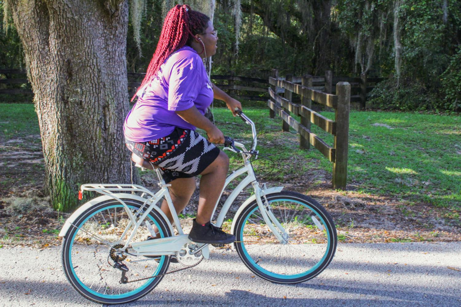 Tamaria Henderson rides her bicycle to support Metamorphosis of Alachua County, the treatment center where she currently lives and battles her alcohol addiction. “You have to want it,” the 20-year-old said.