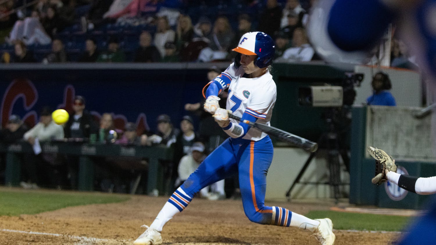 Florida redshirt senior shortstop Skylar Wallace hits an RBI during the Gators' 9-1 win against the Jacksonville Dolphins, Wednesday, Feb. 14, 2024. 