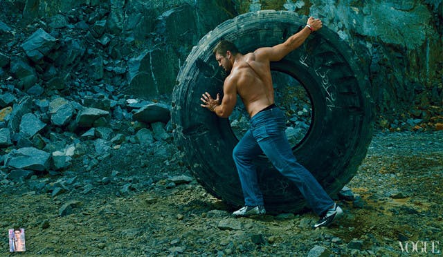 Tim Tebow rolling a tire, as depicted by photography great Anne Leibovitz.