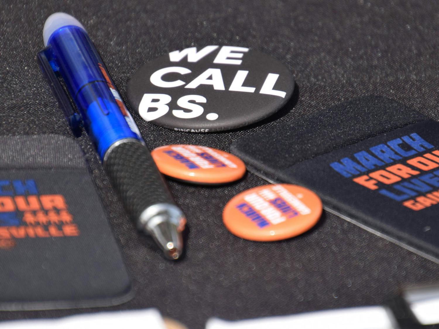 March for Our Lives Gainesville handed out pins, pens and other merchandise to students walking by.